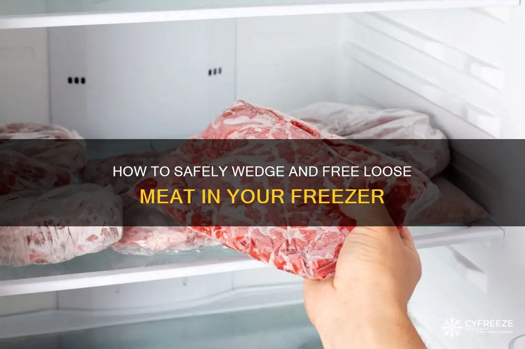 what to use to wedge loose stuck meat in freezer
